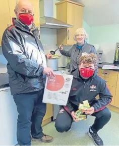  ??  ?? COMMUNITY EFFORT: Volunteer Lindsey Crowe, Kathy Calderwood, Co-op member pioneer, and Jamie Reynolds of the Brechin Community Football Trust.