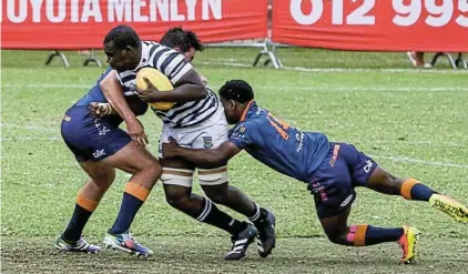  ?? Pictures: Jeppe High School for Boys ?? Jeppe head boy and rugby captain Risima Khosa evades a tackle during a match against Grey College.