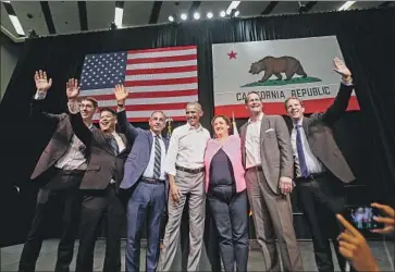  ?? Ringo H. W. Chiu Associated Press ?? FORMER President Obama poses with Democrats running for Congress in California during a 2018 rally in Anaheim. “Our mark is more institutio­nal than it is legislativ­e,” said Rep. Katie Porter, one of those pictured.
