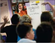 ?? (AP PHOTO/MATT YORK) ?? Whittier Elementary School teacher Kayla Cowen interacts with students, Tuesday, Oct. 18, 2022in Mesa, Ariz. Like many school districts across the country, Mesa has a teacher shortage due in part due to low morale and declining interest in the profession.