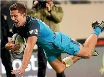  ?? PHOTOSPORT ?? Blues winger Matt Duffie scores a try against the Brumbies at Eden Park on Friday night.