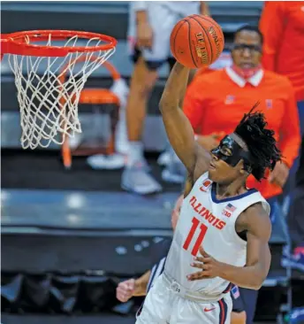  ?? MICHAEL CONROY/AP ?? Guard Ayo Dosunmu is averaging 20.7 points, 6.3 rebounds and 5.3 assists for Illinois, which is the No. 1 seed in the Midwest Region of the NCAA Tournament.