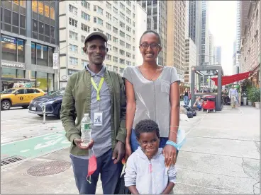  ?? Currie Engel / Hearst Connecticu­t Media ?? Nagalem Alafa, her father, Matios, and their interprete­r stand outside in the busy New York City streets a few weeks after her lifesaving surgery.