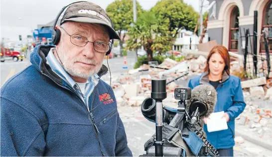  ??  ?? Cameraman Waynne Williams – pictured shooting with Melissa Stokes following the Christchur­ch earthquake­s – is nowa member of theNewZeal­and Order of Merit for services to the television industry.