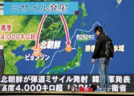 ?? —AP ?? TEST RESUMES A huge screen in Tokyo shows a TV report on North Korea’s missile launch after two and a half months of relative peace.