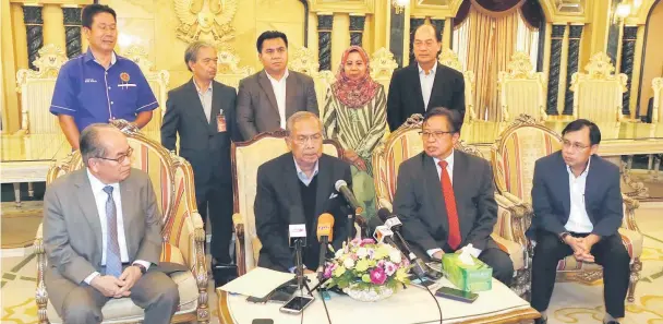  ??  ?? Adenan fielding questions from reporters. Also seen are (seated from left) Uggah, Abang Johari and Dr Rundi. The five elected representa­tives are (standing from left) Ilus, Paulus, Gerawat, Rosey and Miro. — Photo by Kong Jun Liung