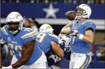  ?? RON JENKINS / ASSOCIATED PRESS ?? Chargers quarterbac­k Philip Rivers passed for 434 yards and three touchdowns in the first Thanksgivi­ng game of his 14-year NFL career. Rivers completed 27 of 33 attempts.