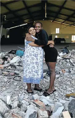  ?? Picture: Sandile Ndlovu ?? Thembelihl­e Ndabandaba at the Pentecosta­l Holiness Church in Ndlangubo with her granddaugh­ter S’bani Phiri, who cheated death there two years ago.