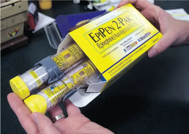  ?? RICH PEDRONCELL­I / THE CANADIAN PRESS / THE ASSOCIATED PRESS FILES ?? Pfizer, the maker of EpiPen, says its adult-dose auto-injector may not be available at all in August, a peak month for those dependent on the drug.