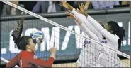  ?? AP/COLIN E. BRALEY ?? Nebraska outside hitter Mikaela Foecke (2) has a blocked shot come back to her Saturday as Florida setter Cheyenne Huskey (11) and middle blocker Rhamat Alhassan (1) defend during an NCAA Division I volleyball championsh­ip game in Kansas City, Mo.