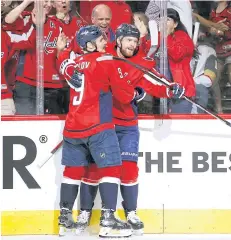  ?? AP ?? The Capitals’ Evgeny Kuznetsov, right, celebrates his goal against the Golden Knights with Dmitry Orlov.