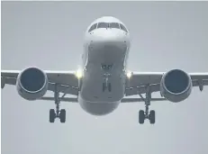  ?? GETTY IMAGES FILES ?? China’s home-grown C919 passenger jet lands at Pudong Internatio­nal Airport on its maiden flight on May 5. Bombardier is in investment talks with Commercial Aircraft Corporatio­n of China Ltd.