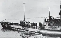  ?? ASSOCIATED PRESS FILE PHOTO ?? In this undated photo, people stand on the deck of a World War I German submarine type UC-97 at an unknown location. Authoritie­s say that an intact German World War I submarine has been found off the coast of Belgium.