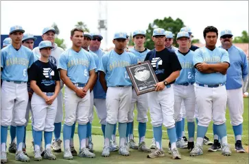  ?? RECORDER PHOTO BY NAYIRAH DOSU ?? Members of the Monache High School baseball team pose with the runners-up plaque after a 4-1 loss to Chowchilla High School in the CIF Central Section Division IV Championsh­ip game, Saturday, May 18, 2019, at Pete Beiden Field at Bob Bennet Stadium in Fresno.