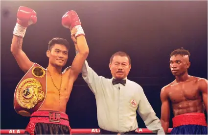  ?? SUNSTAR FILE ?? ONE YEAR TURNAROUND. Mark Magsayo celebrates his first-round knockout against Issa Nampepeche in April 2017 when he was still with ALA Promotions. A year later, boxer and promoter may be headed to the court to settle who has the right to promote the...