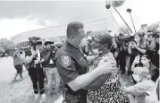  ?? ERIC GAY AP ?? Houston Police Chief Art Acevedo and Charlene Davis embrace after Davis prayed for him Monday.