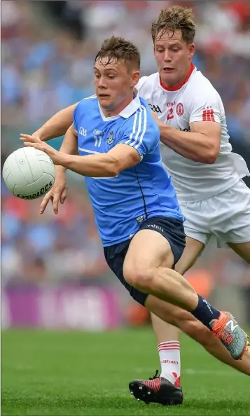  ??  ?? Con O’Callaghan of Dublin is chased by Kieran McGeary of Tyrone during the All-Ireland semi-final.