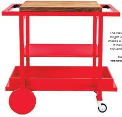  ?? THE NEW TRADITIONA­LISTS ?? The New Traditiona­lists’ bright red Bar Cart No. 1 makes a bold statement. It has a butcher block top and removable tray. $2,500, thenew traditiona­lists.com