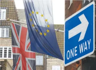  ??  ?? A UNION flag flies next to the flag of the European Union in London, Britain, Nov. 4.