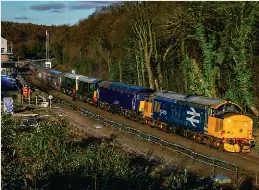  ?? Gavin Bland ?? Returning to main line use for the first time following its sale by Direct Rail Services to Locomotive Services, 37409 hauls 57303, Class 20s D8107 Jocelyn Fielding 1940-2020 (20107) and D8096 (20096), and long-stored former DB Cargo Mk.2 coaches 5959, 6152, 5924, 6036 and 5922 through Dore & Totley station working 5Z63, the 12.49 Worksop to Crewe.