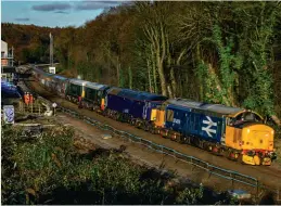  ?? Gavin Bland ?? Returning to main line use for the first time following its sale by Direct Rail Services to Locomotive Services, 37409 hauls 57303, Class 20s D8107 Jocelyn Fielding 1940-2020 (20107) and D8096 (20096), and long-stored former DB Cargo Mk.2 coaches 5959, 6152, 5924, 6036 and 5922 through Dore & Totley station working 5Z63, the 12.49 Worksop to Crewe.