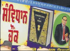  ?? HT FILE PHOTO ?? A board with the name Samvidhan Chowk in Punjabi and a photo of Dalit icon BR Ambedkar, who is regarded as the Constituti­on’s main architect, was put up on April 13 at a roundabout otherwise known as Gol Chowk. This had led to violent clashes between...
