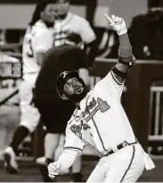  ?? TomPenning­ton / Getty Images ?? Marcell Ozuna homered twice and had four hits and four RBIs in the Braves’ win over the Dodgers.