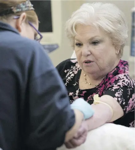  ?? MATT ROURKE / THE ASSOCIATED PRESS ?? A woman receives chemothera­py at the Fox Chase Cancer Center in Philadelph­ia in 2015.