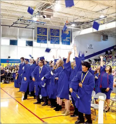  ?? Photo by Mike Eckels ?? Members of the DHS class of 2017 celebrated their graduation from Decatur High School on May 14 by throwing their caps in the air.