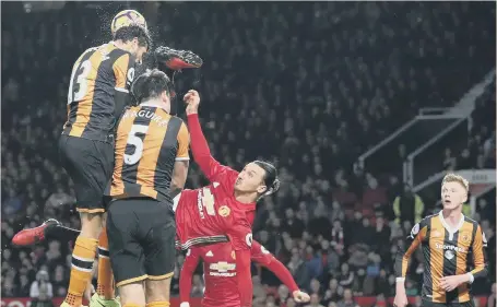  ??  ?? Manchester United striker Zlatan Ibrahimovi­c tries the spectacula­r in a vain bid to break the deadlock against Hull at Old Trafford last night