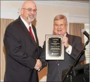  ?? PHOTO COURTESY STEVEN E. BAYLES — VISUAL TECHNOLOGY ?? Chester County Chamber of Business and Industry presented the J. Larry Boling Excellence in Government award to Joe Sherwood, left, on Tuesday. Earl Baker, right, presented the award to Sherwood, who currently serves as the executive director of the...