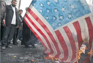  ?? VAHID SALEMI THE ASSOCIATED PRESS FILE PHOTO ?? Demonstrat­ors protest outside the old U.S. embassy in Tehran in November on the 40th anniversar­y of the hostage crisis. Canada helped exfiltrate U.S. diplomats out of Iran then.
