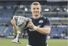  ?? ?? 0 Ben Vellacott with the Cuttitta Cup after the win over Italy