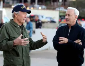  ??  ?? BIG STARS: Clint Eastwood and Tom Hanks on the set of Sully, which was written and produced by Todd Komarnicki