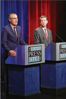  ?? CURTIS COMPTON / CCOMPTON@AJC.COM ?? Lt. Gov. Casey Cagle and Secretary of State Brian Kemp, the two remaining Republican­s in the race for Georgia governor, face off in the Atlanta Press Club debate at the Georgia Public Broadcasti­ng studios on Thursday in Atlanta.