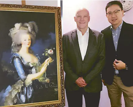  ??  ?? Watchmen to modern-day princes and princesses: Breguet vice president Martin Ganz and Lucerne managing director Emerson Yao, beside a portrait of Marie Antoinette