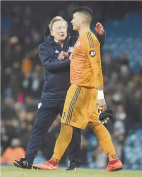  ?? AP FOTO ?? GOOD ONE. Cardiff City manager Neil Warnock greets Philippine­s internatio­nal and Cardiff’s goalkeeper Neil Etheridge after their match against Man City. Etheridge’s second half saves kept the scoreline respectabl­e against EPL’s top team.