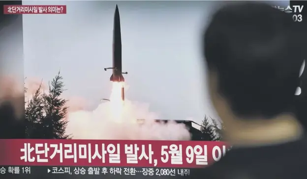  ??  ?? 0 A man in South Korea watches a television news screen showing footage of another in a series of North Korean missile launches