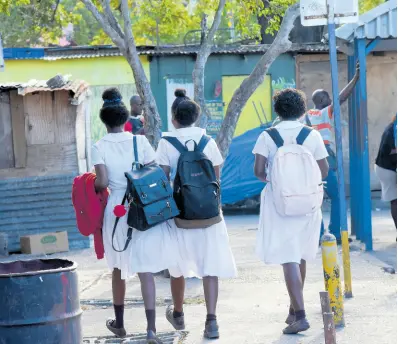  ?? FILE ?? In this file photo a group of students are seen walking in the Montego Bay Transporta­tion Centre.