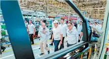  ?? ?? Philippine President Ferdinand Marcos, Jr., Toyota Motor Corp. Chairman Akio Toyoda and Toyota Motor Philippine­s (TMP) Chairman Alfred V. Ty visit the TMP plant in Santa Rosa, Laguna to check out the sustainabl­e practices employed in production.