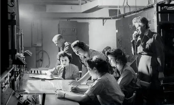  ??  ?? BELOW WAAF radar operators plotting aircraft on the cathode-ray tube monitor. August 1945
