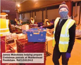  ?? ?? James Mulchrone helping prepare Christmas parcels at Maidenhead Foodshare. Ref:134134-2