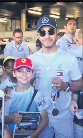  ??  ?? Archie Clark from Peckleton met his racing hero Lewis Hamilton at the Formula 1 Grand Prix.