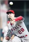  ?? Michael Wyke Associated Press ?? ANDREW HEANEY threw six scoreless innings to help the Angels beat Houston.