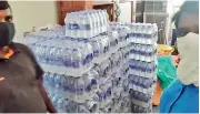  ??  ?? King Koti hosp. staff supplied with crates of bottled water.