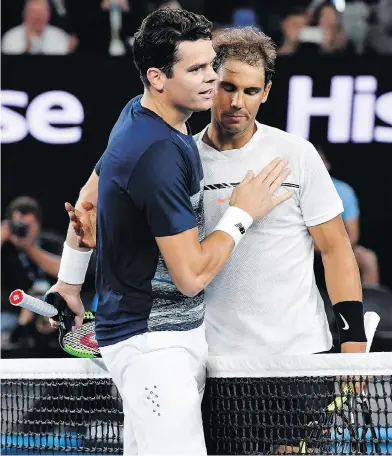  ?? ANDY BROWNBILL / THE ASSOCIATED PRESS ?? Spain’s Rafael Nadal, right, is congratula­ted by Canada’s Milos Raonic after winning their quarter-final at the Australian Open in Melbourne on Wednesday. Raonic had been forced to take a medical timeout in the second set.