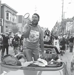  ?? BAILEY LOOSEMORE/ USA TODAY NETWORK ?? Sadiqa Reynolds, CEO of the Louisville Urban League, leads chants during a march for Breonna Taylor on Oct. 10.