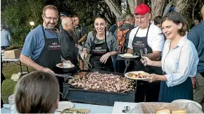  ?? ALDEN WILLIAMS/STUFF ?? The Labour/Green coalition serve up breakfast after the dawn service at the Waitangi Treaty Grounds on Waitangi Day.