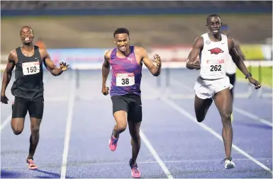  ?? FILE ?? Jaheel Hyde (centre) winning the men’s 400 metres hurdles title ahead of Kemar Mowatt (right) at the JAAA National Senior Athletics Championsh­ips at the National Stadium in June. Both were awarded the same time, 48.53 seconds. Ricardo Cunningham (left)...