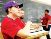  ?? STAFF PHOTO BY C.B. SCHMELTER ?? Ooltewah High School senior Cade Shortt shares his thoughts in a small-group exercise during Camp College in Spencer Hall at Sewanee: The University of the South on Friday in Sewanee, Tenn.